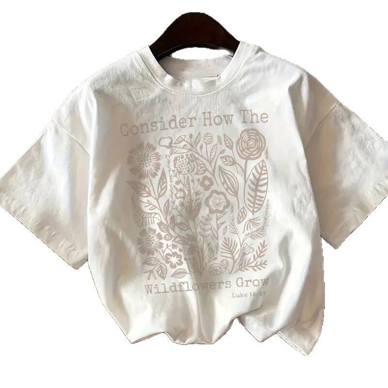 Dame T-shirt med florale motiv og inspirerende skrift Stilla