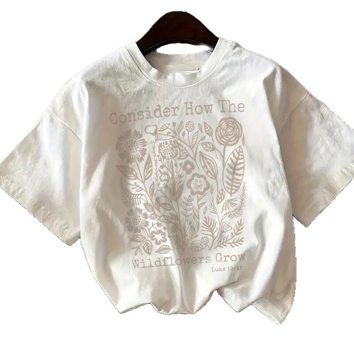 Dame T-shirt med florale motiv og inspirerende skrift Stilla