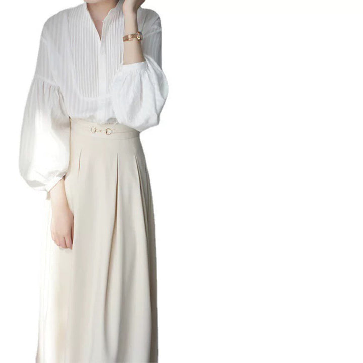Damebluse med voluminøse ærmer og elegant plissébehandling Stilla