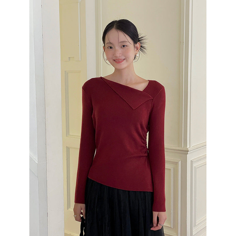 Dame top med asymmetrisk skæring og raffineret indpakningsdetail Stilla