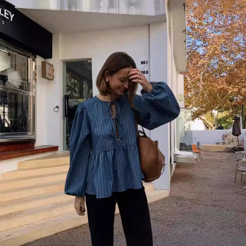 Dame skovhuggerbluse med afslappet snit og puffærmer Stilla