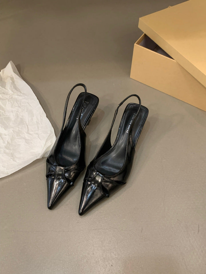 Dame Slingback-pumps med spids tåområde og dekorativt sløjfedesign Stilla