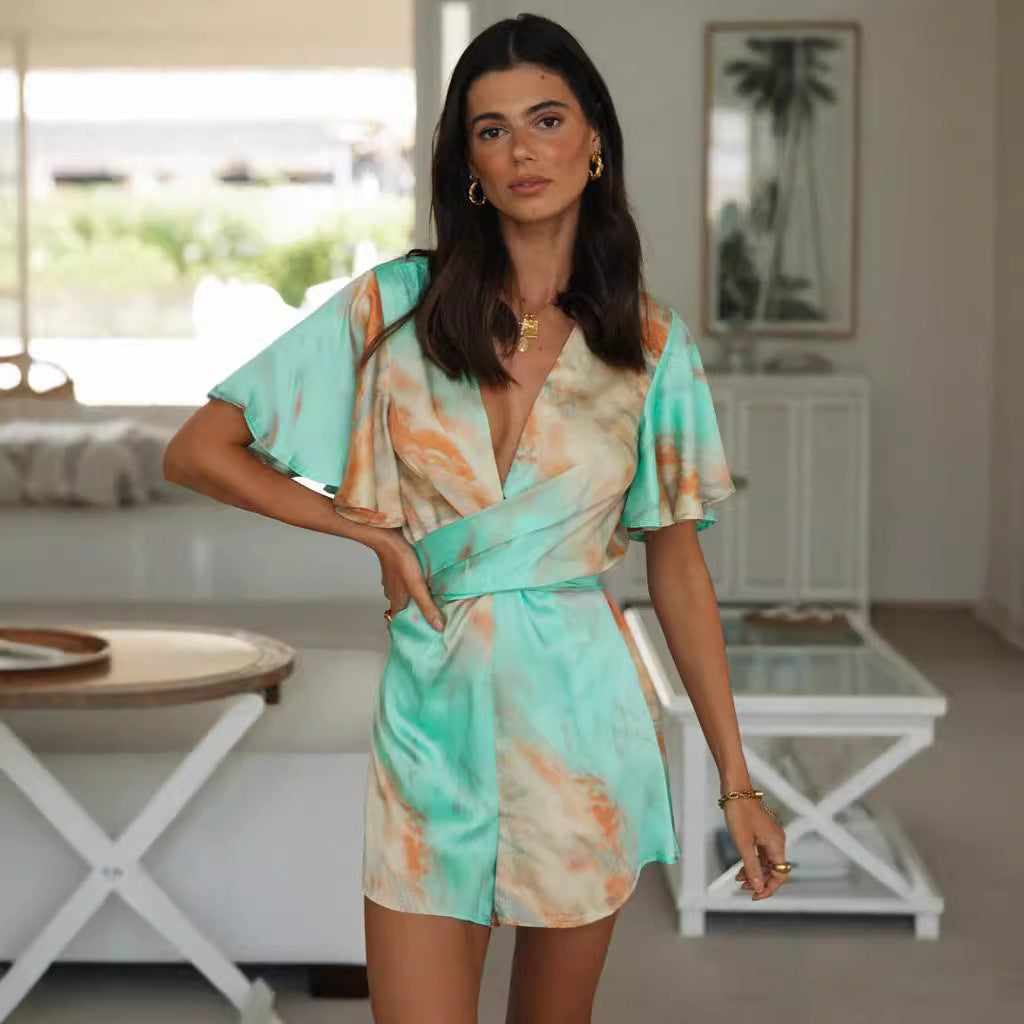 Kvinders omslags jumpsuit med voluminøse ærmer og dyb V-hals Stilla
