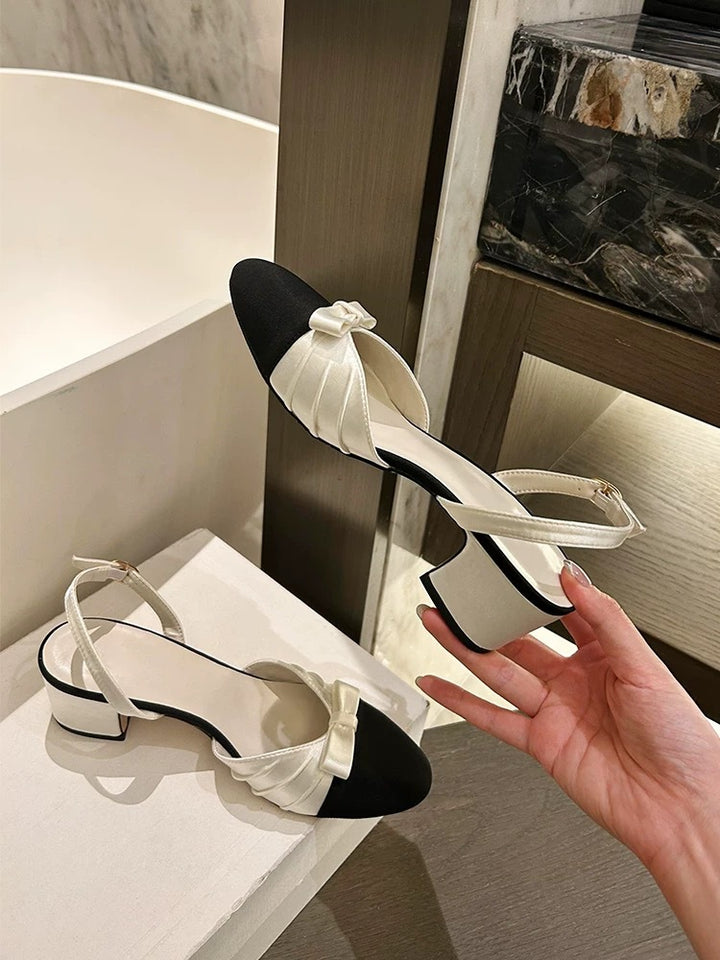 Dame Slingback-pumps med elegant satindetalje og struktureret sål Stilla