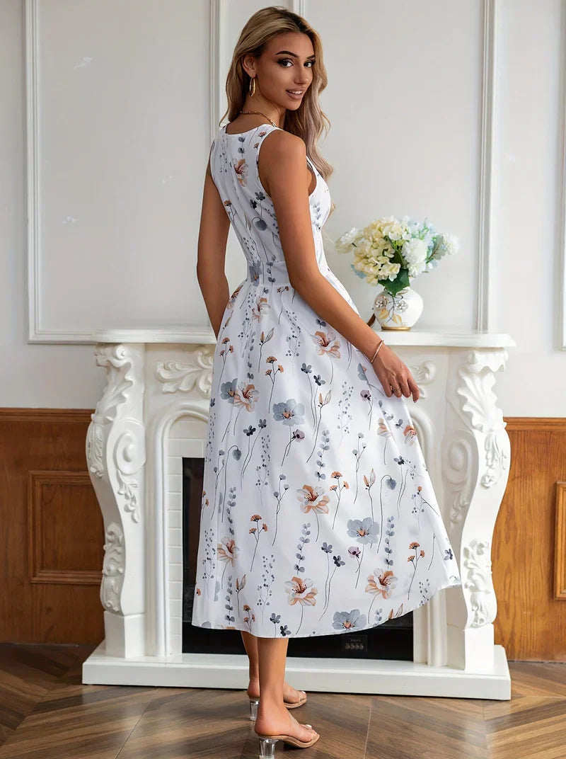 Stilla | Elegant Midikjole Med Blomsterprint, Dyb V-udskæring og Høj Talje