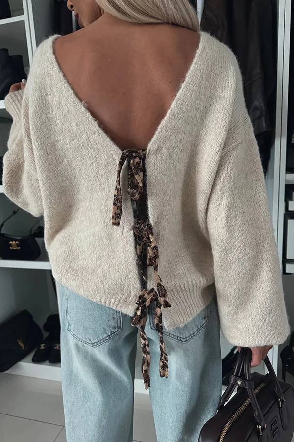 Stilla | Strikpullover med trendy kvaster, leopardmønster og bindebånd