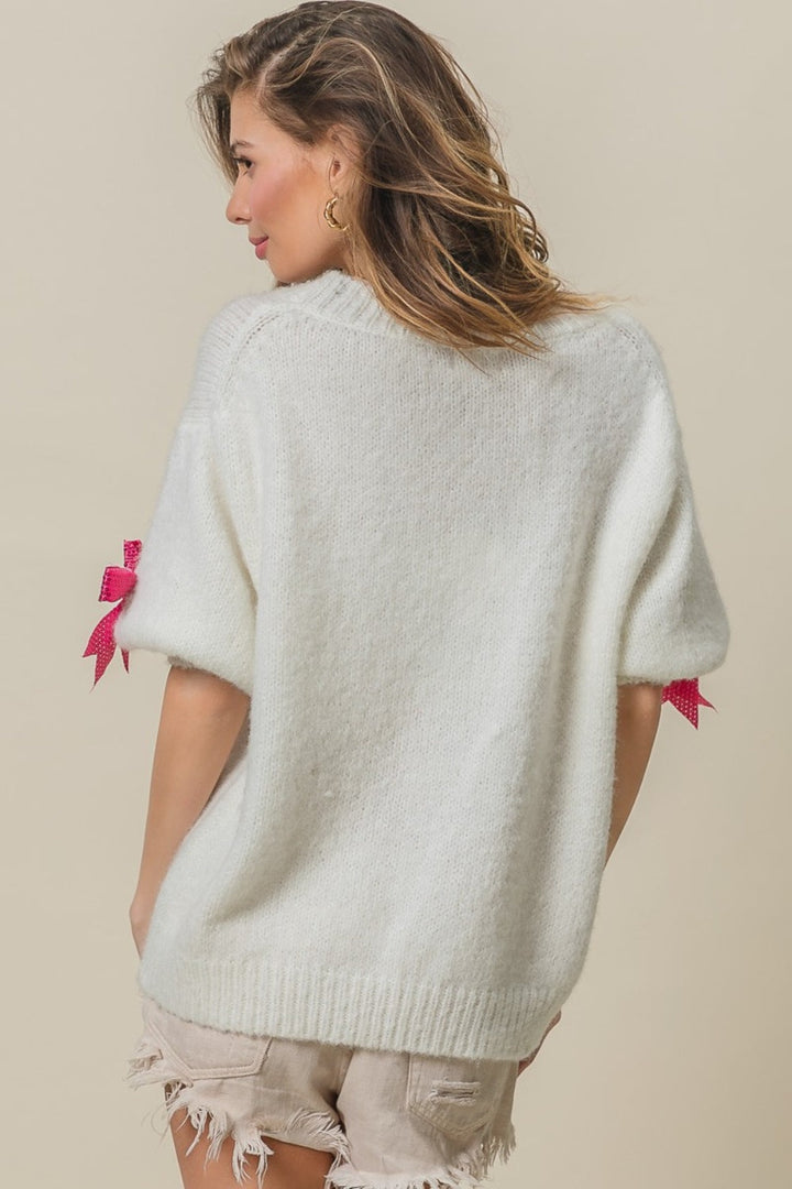 Stilla | Pullover med pailetter, knude og puffærmer